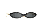Oval sunglasses with a black studded frame, dark lenses, and light beige temples, shown on a clean white background.