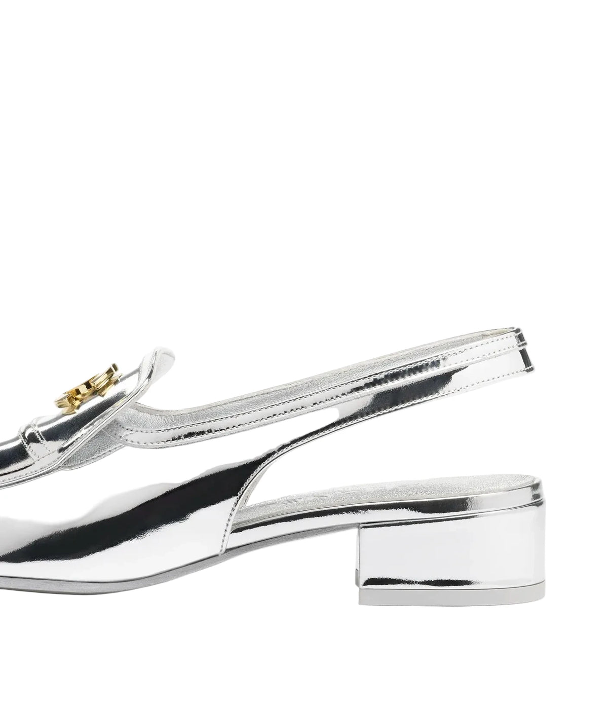 A close-up side view of a metallic silver slingback shoe with a low block heel and a small gold logo detail on the side, set against a plain white background.