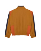 A colorblock windbreaker jacket shown from the back, featuring a dominant mustard yellow body with orange side panels and navy blue sleeve stripes, set against a plain off-white background.