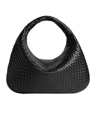 Black woven handbag on a light gray background