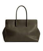 Brown leather handbag on a light gray background