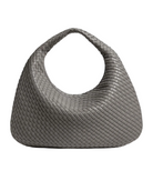 Gray woven handbag on a light gray background