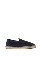 Blue loafer shoe with a gold buckle on a white background
