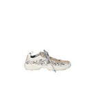 A single chunky sneaker with a white sole, beige mesh upper, and dense silver rhinestone embellishments, shown from the side against a solid light beige background.