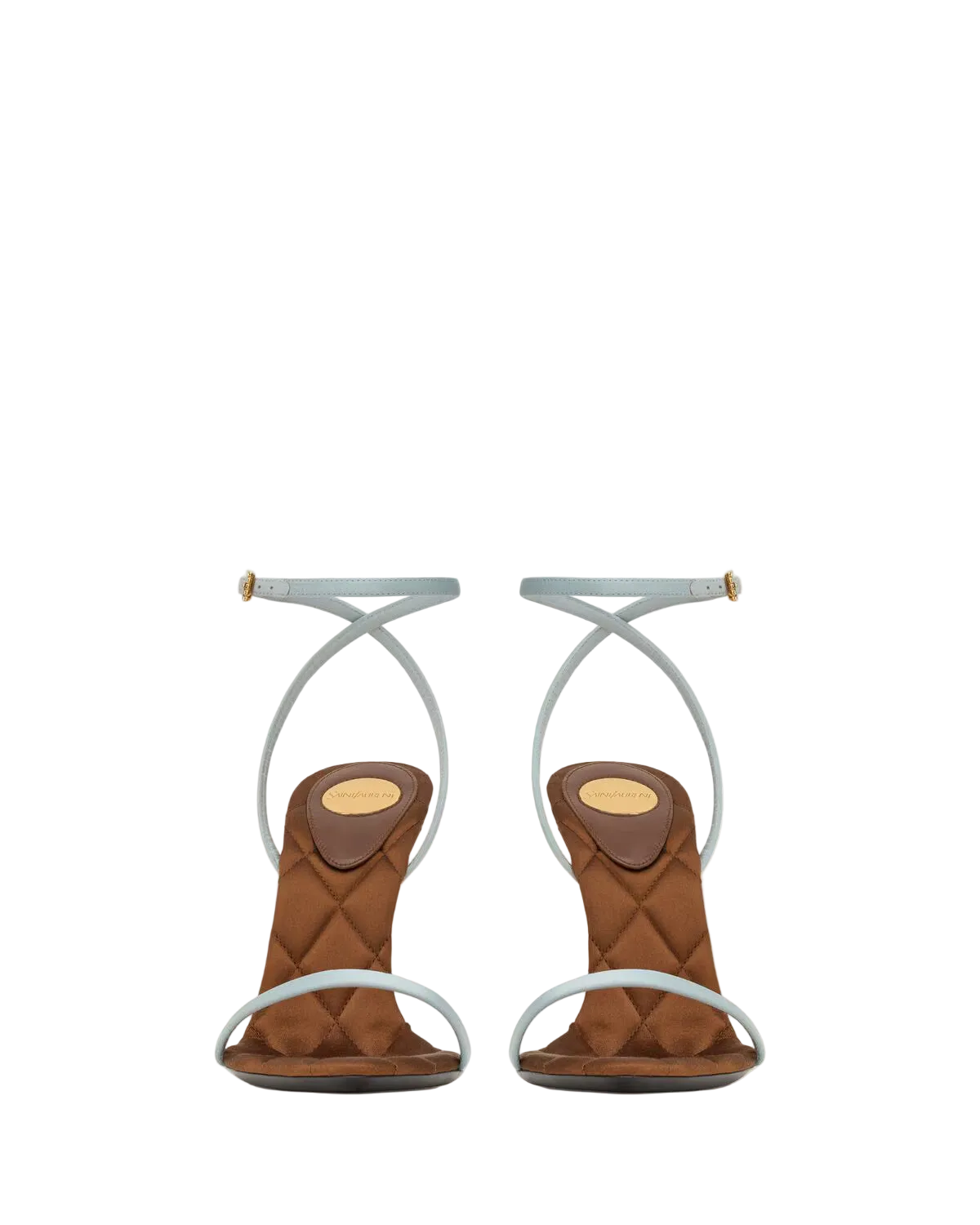 A pair of women's mid-height heeled sandals with quilted brown suede-like footbeds and thin, light blue wraparound straps, shown from the back against a plain off-white background.