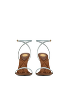 A pair of women's mid-height heeled sandals with quilted brown suede-like footbeds and thin, light blue wraparound straps, shown from the back against a plain off-white background.