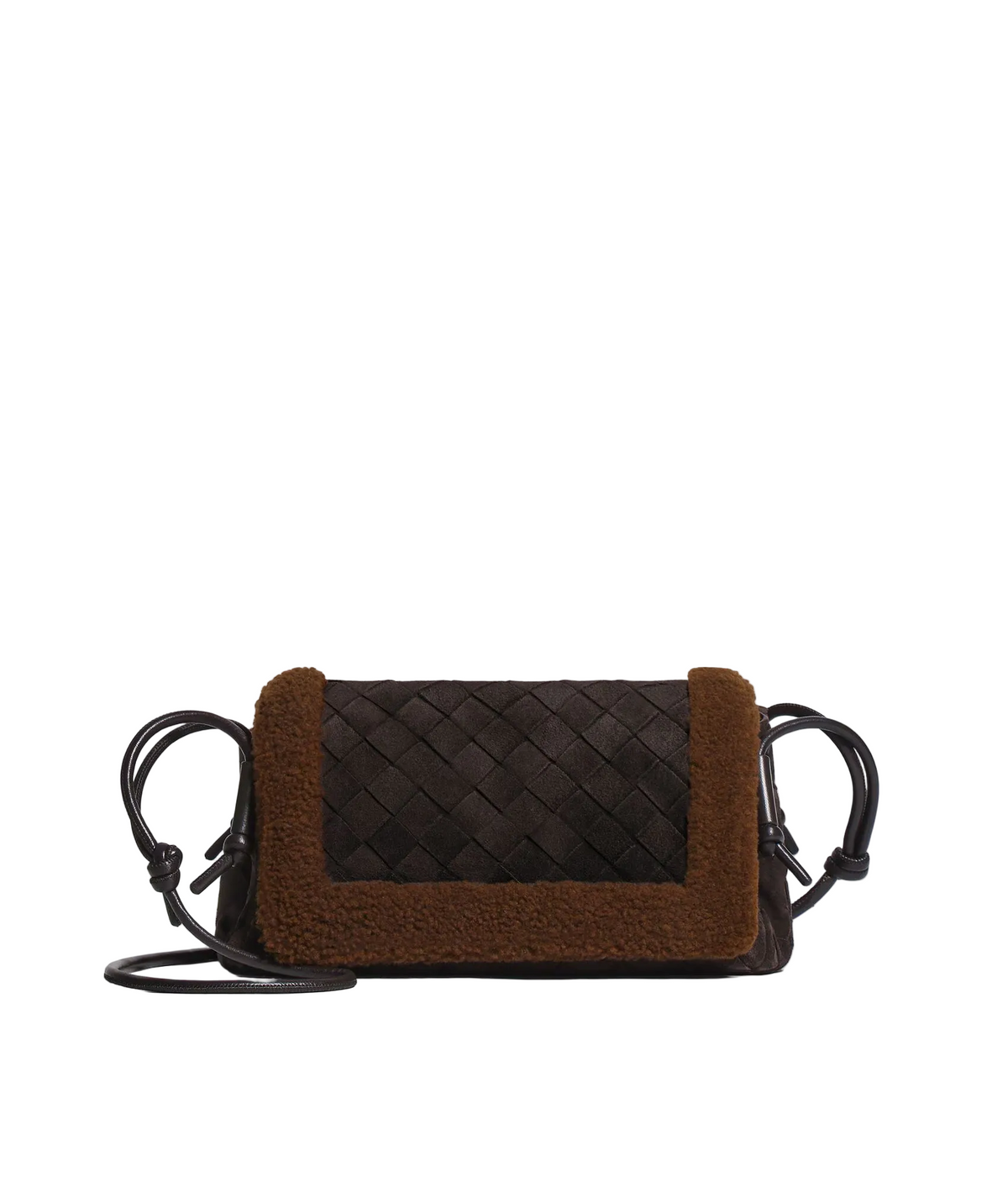 A small crossbody bag with a dark brown woven leather front, a brown sherpa fleece trim, and dark brown knotted strap details, shown on a light gray background.