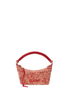 Red and beige handbag with a textured pattern on a light gray background