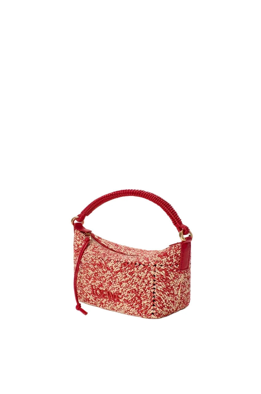 Red handbag with a textured pattern on a white background