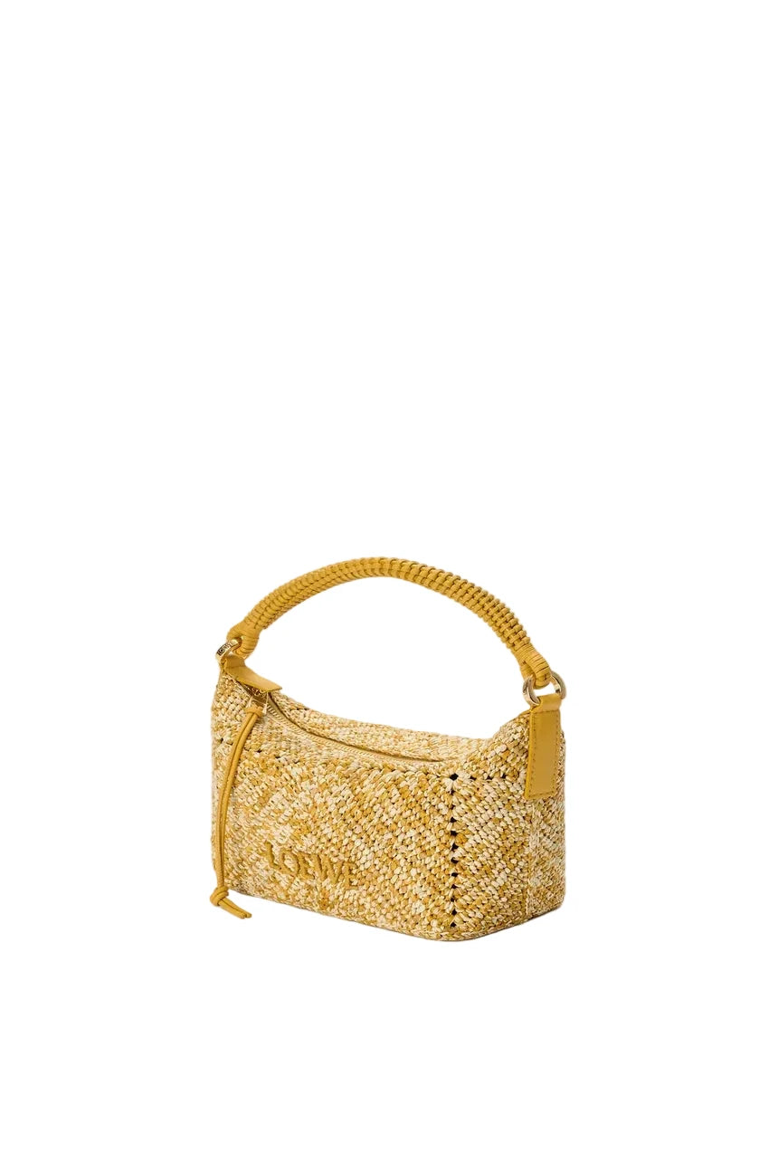 Yellow woven handbag on a white background