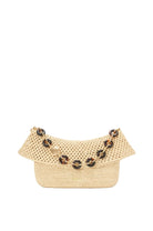 Woven handbag with decorative elements on a light gray background