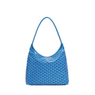 Blue patterned handbag on a light gray background