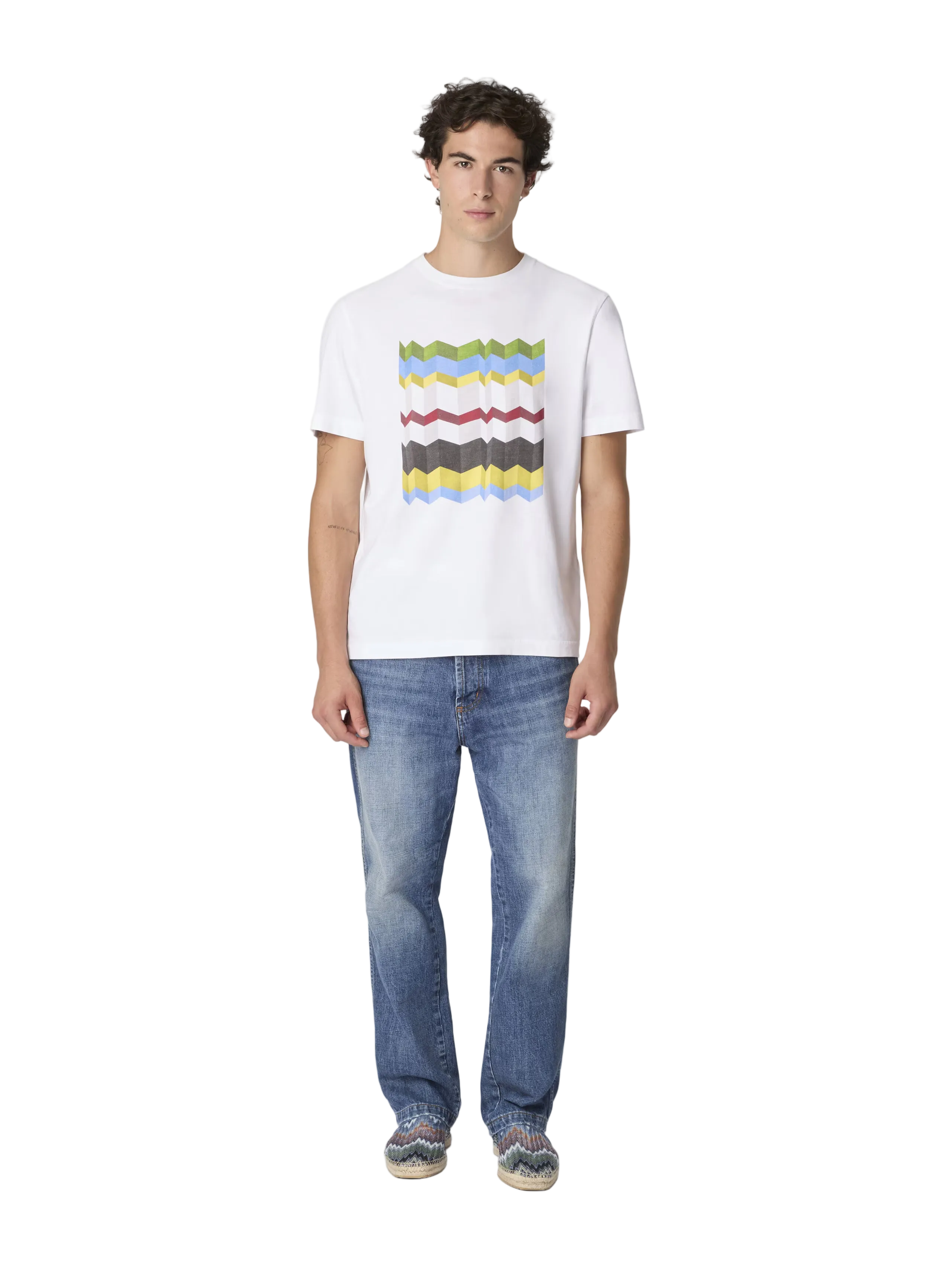 Person wearing a white t-shirt with colorful stripes and blue jeans on a white background