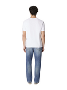 Person wearing a white t-shirt and blue jeans on a white background