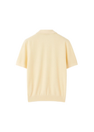 Light yellow polo shirt on a white background