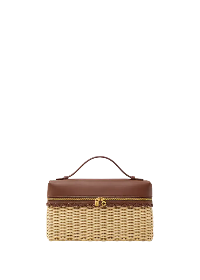 Wicker jewelry box with brown leather top on a white background