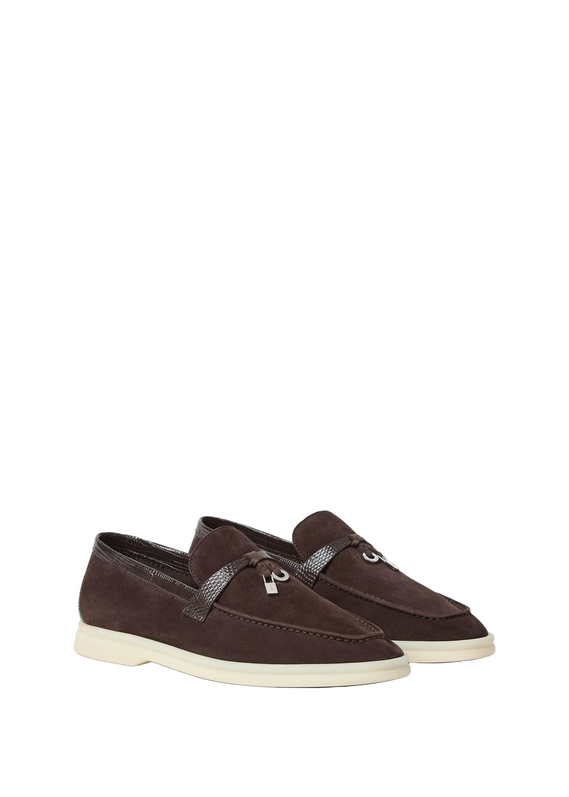 Pair of brown loafers on a light beige background