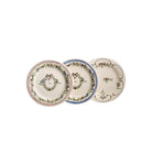 Three decorative ceramic plates with floral and monogram patterns, displayed overlapping on a clean white background.