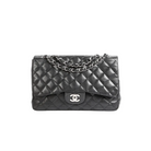 A black quilted Chanel flap bag with silver-tone chain strap and interlocking CC logo, photographed against a plain white background.