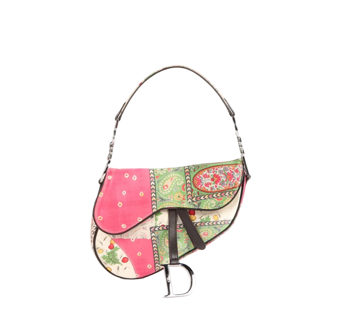 A patchwork saddle bag featuring vibrant pink, green, and beige floral patterns, with dark brown leather trim and a silver-tone metal bit on a white background.