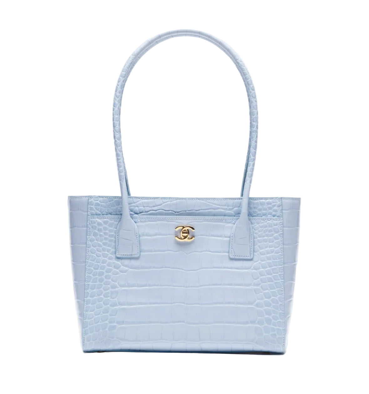 A light blue crocodile-embossed leather tote bag with double top handles and a gold-tone interlocking G logo on the front, set against a plain white background.