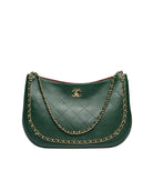 A dark green quilted leather shoulder bag with a gold-tone chain strap and a gold interlocking CC logo on the front, set against a plain white background.