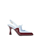 A single women's slingback high heel shoe with a light blue upper and a glossy deep burgundy patent leather toe cap and heel, featuring a small gold-tone anchor emblem on the side.