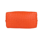 Bright orange woven leather pouch with a rectangular shape and top zipper closure, photographed on a clean white background.
