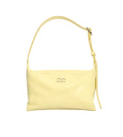 Yellow handbag with Chanel logo on a white background