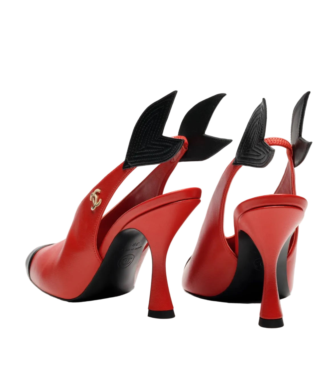 Red high-heeled shoes with black accents on a white background