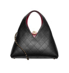 Black quilted handbag with gold chain detail on a white background