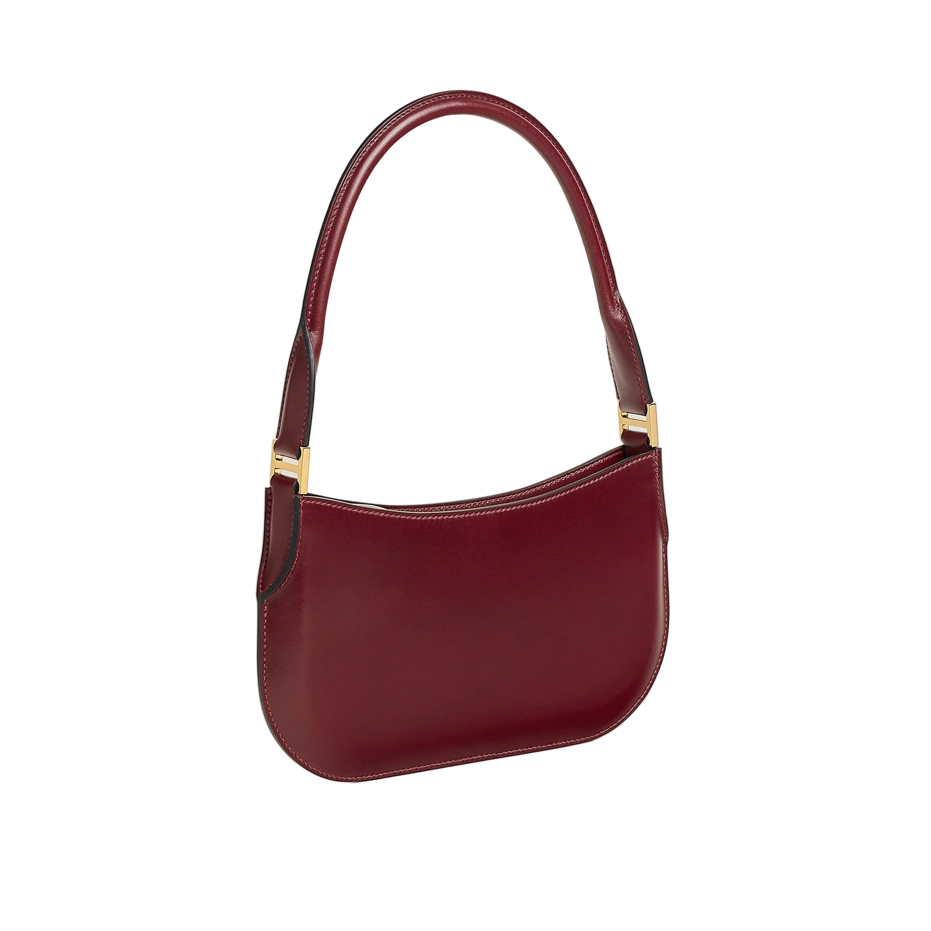 Maroon handbag with gold accents on a light beige background