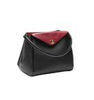 Black handbag with a red flap and gold logo on a white background