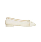 Yellow sandal with a cut-out design on a white background