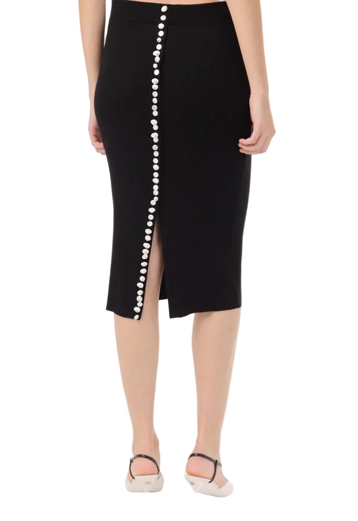 Black pencil skirt with pearl buttons on a white background