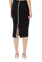 Black pencil skirt with pearl buttons on a white background