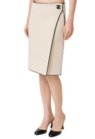 White pencil skirt with black trim and Chanel logo on a white background