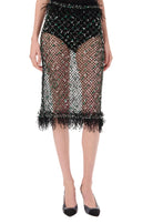 Black fishnet skirt with fringe on a white background