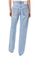 Light blue jeans worn by a person on a white background