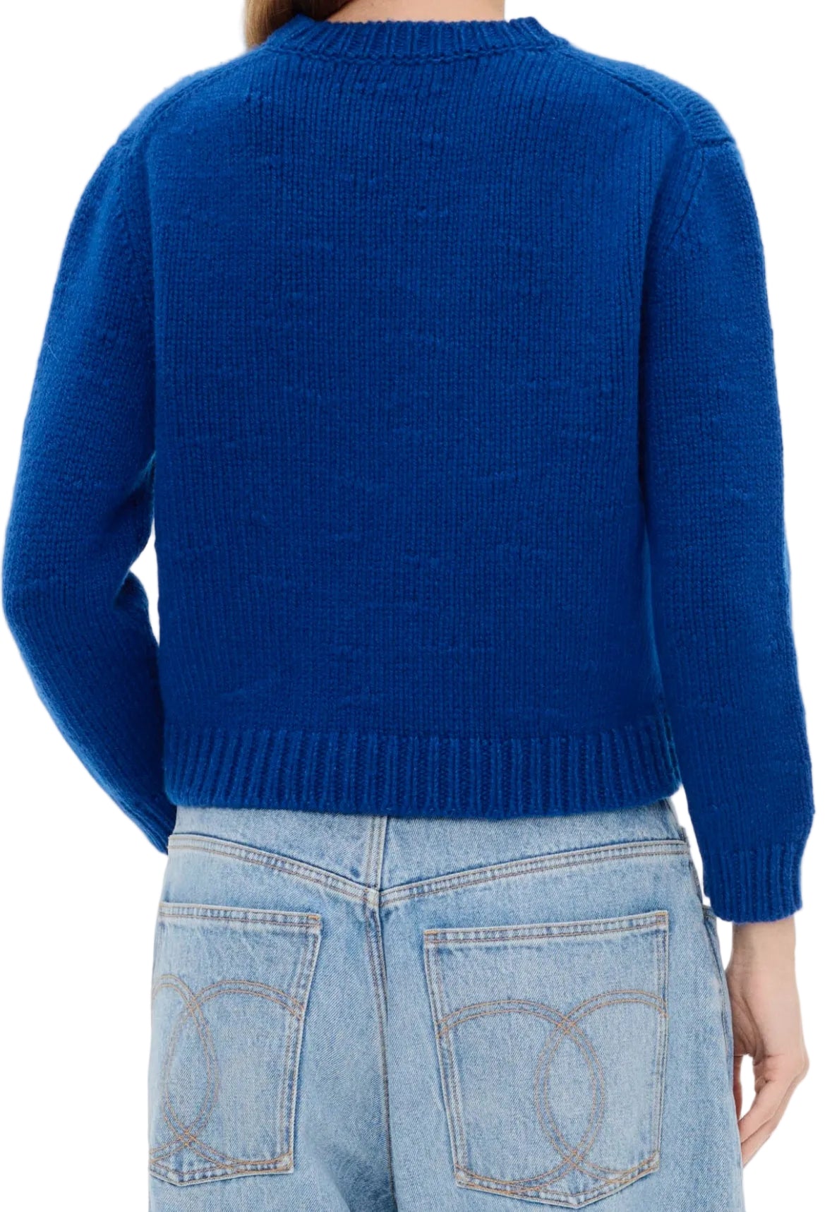 Blue sweater worn by a person on a white background