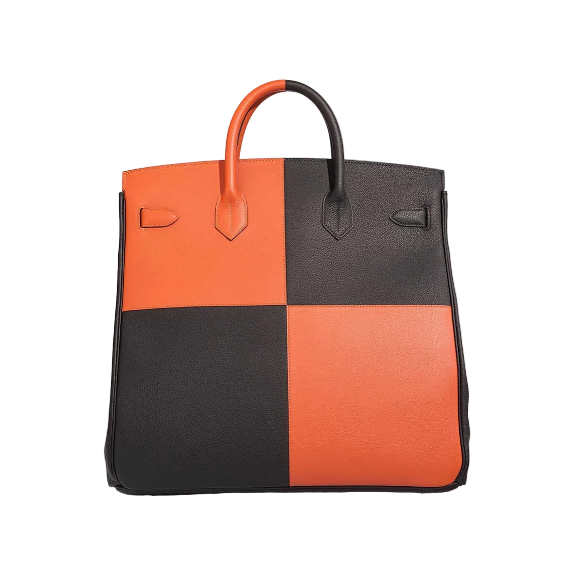Two-toned black and orange handbag on a light gray background