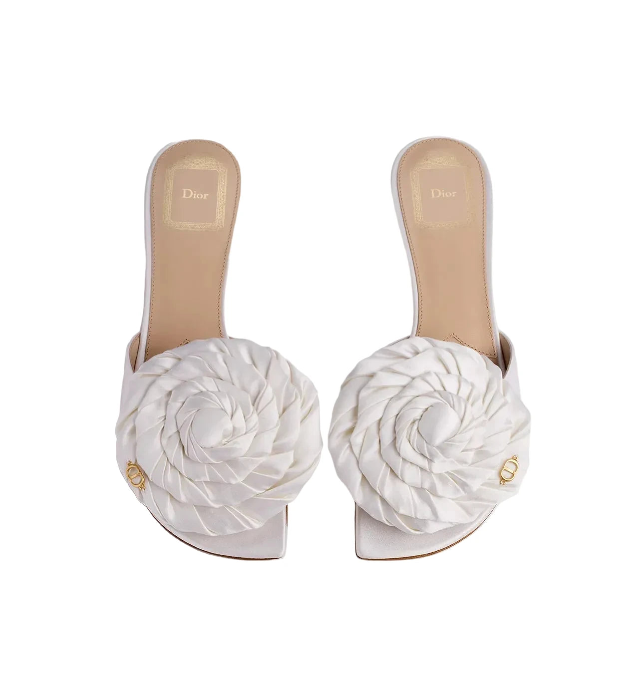 White sandals with floral designs on a light gray background