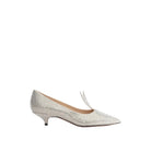 A single women's kitten heel pump in textured silver snakeskin print with a small bow detail on the vamp, shown in profile against a light gray background.