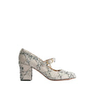 A single Mary Jane style block heel shoe in a textured snakeskin pattern of beige, gray, and black, featuring a pearl embellishment on the strap, shown against a plain white background.