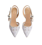 A pair of white pointed-toe slingback heels with floral lace-up embroidery and rhinestone embellishments, shown from a top-down view on a light gray background.