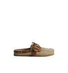 A single slip-on mule shoe in beige suede with a brown leather strap and gold-tone buckle, shown in profile against a light gray background.