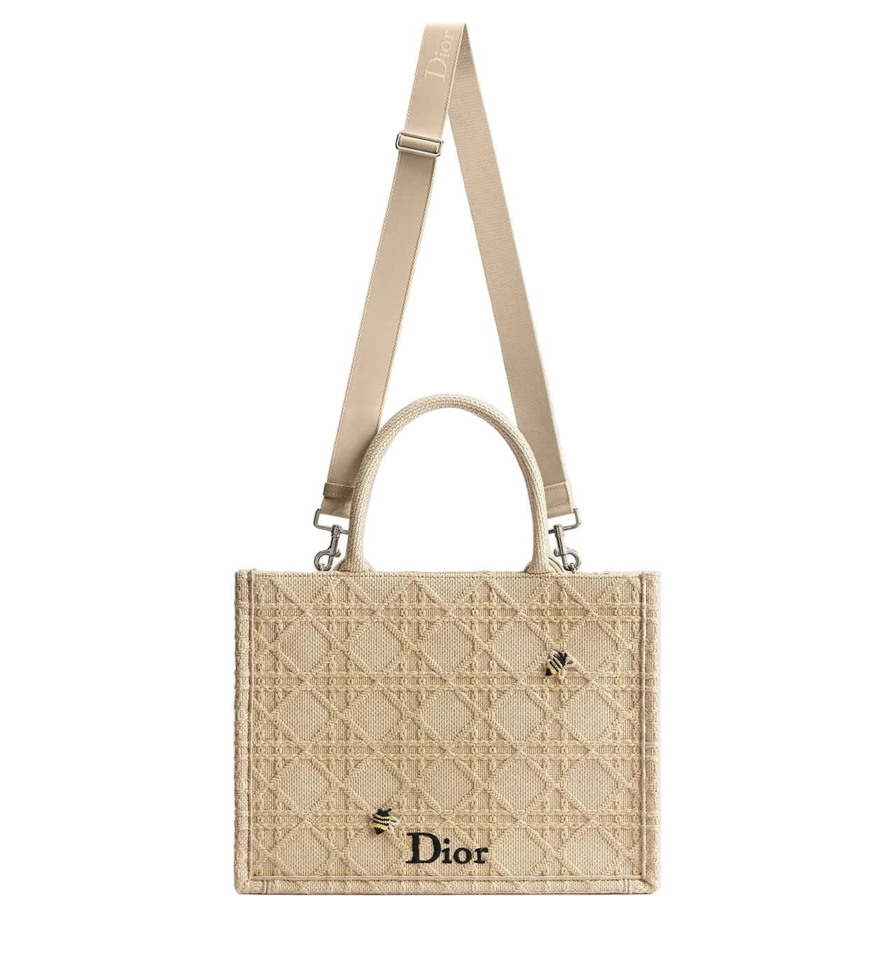 Beige Dior handbag with a strap on a light gray background