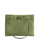 An olive green quilted tote bag with a matching fabric bow at the top center, silver-tone grommets, and a single shoulder strap, photographed against a light gray studio background.