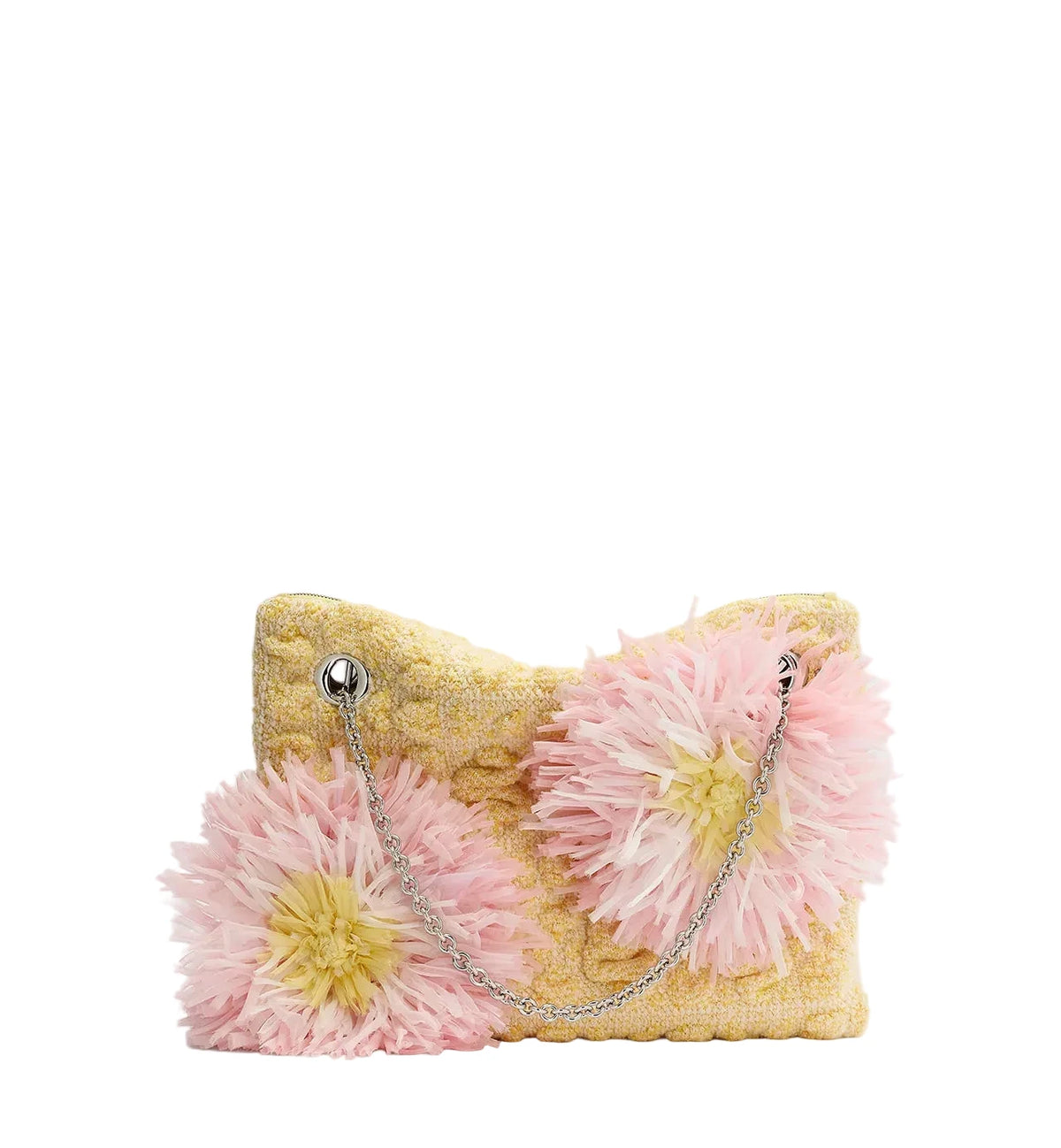 A yellow textured clutch bag featuring two large pink feathered flower appliqués and a silver chain strap, photographed on a clean white background.