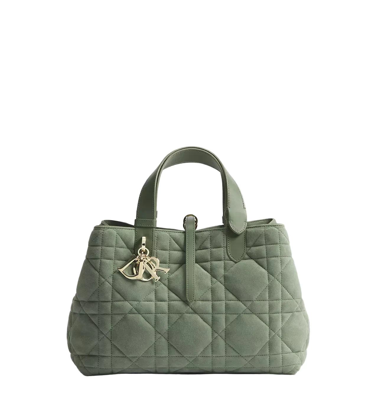 Green quilted handbag with a brand logo on a light gray background